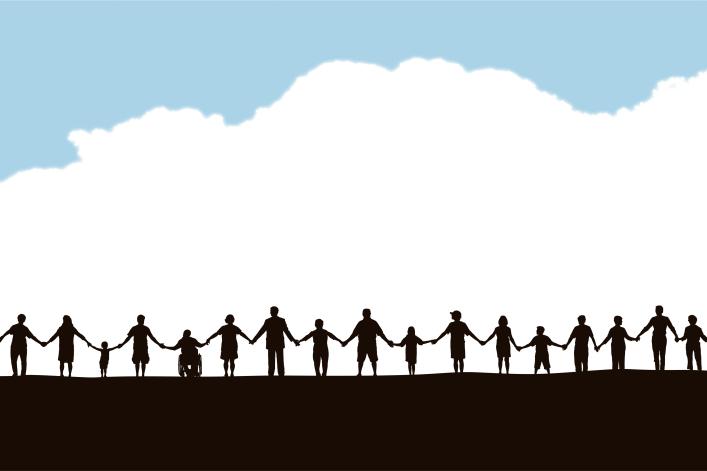 Image of community members holding hands in a line