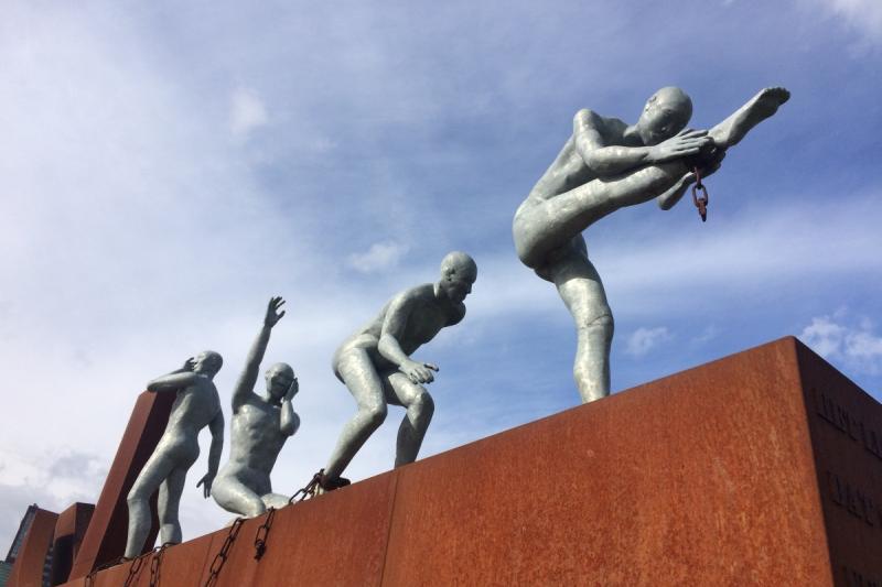 Four statues in various poses.