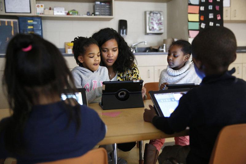 Kindergarten teacher Marissa McGee with several students. (Photo by Elissa Nadworny/NPR)