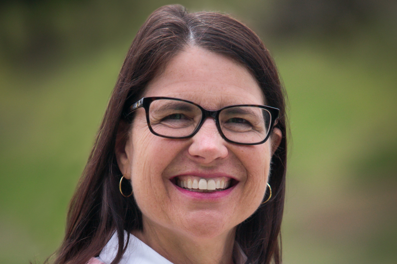 Woman outside in pink sweater