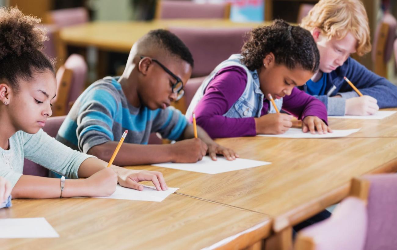 Students in a classroom taking a test