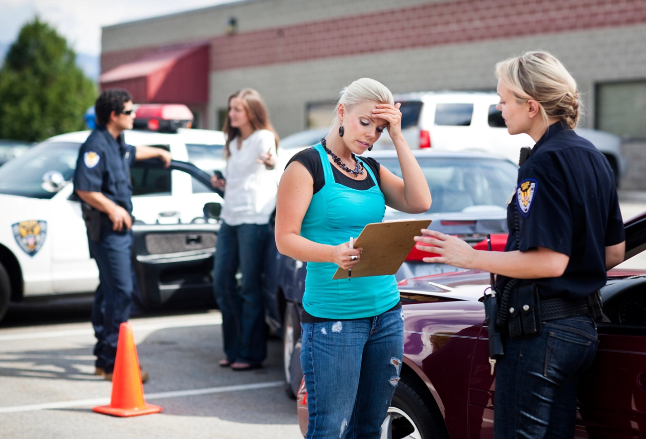 Getty Image of woman talking to police officer