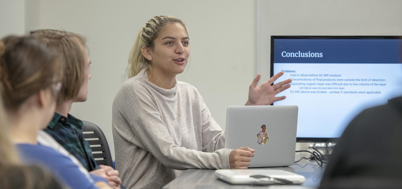 Student shares project findings in a presentation