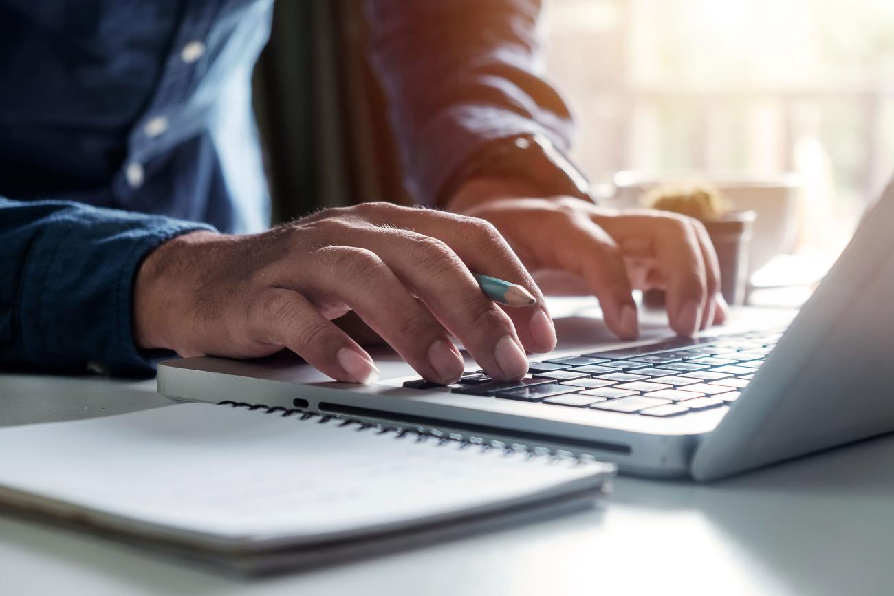 Photo of man typing on keyboard. (Photo: mrmohock/Shutterstock)