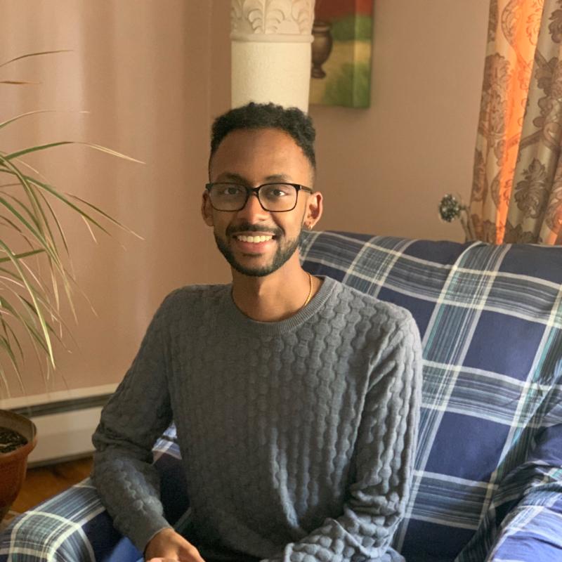Joshua Jordan, at home, sitting in an armchair