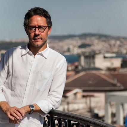 Batuhan Aydagül, MA ’02, in 2013 outside the Education Reform Initiative's office in the Karakoy neighborhood of Istanbul. (Phot